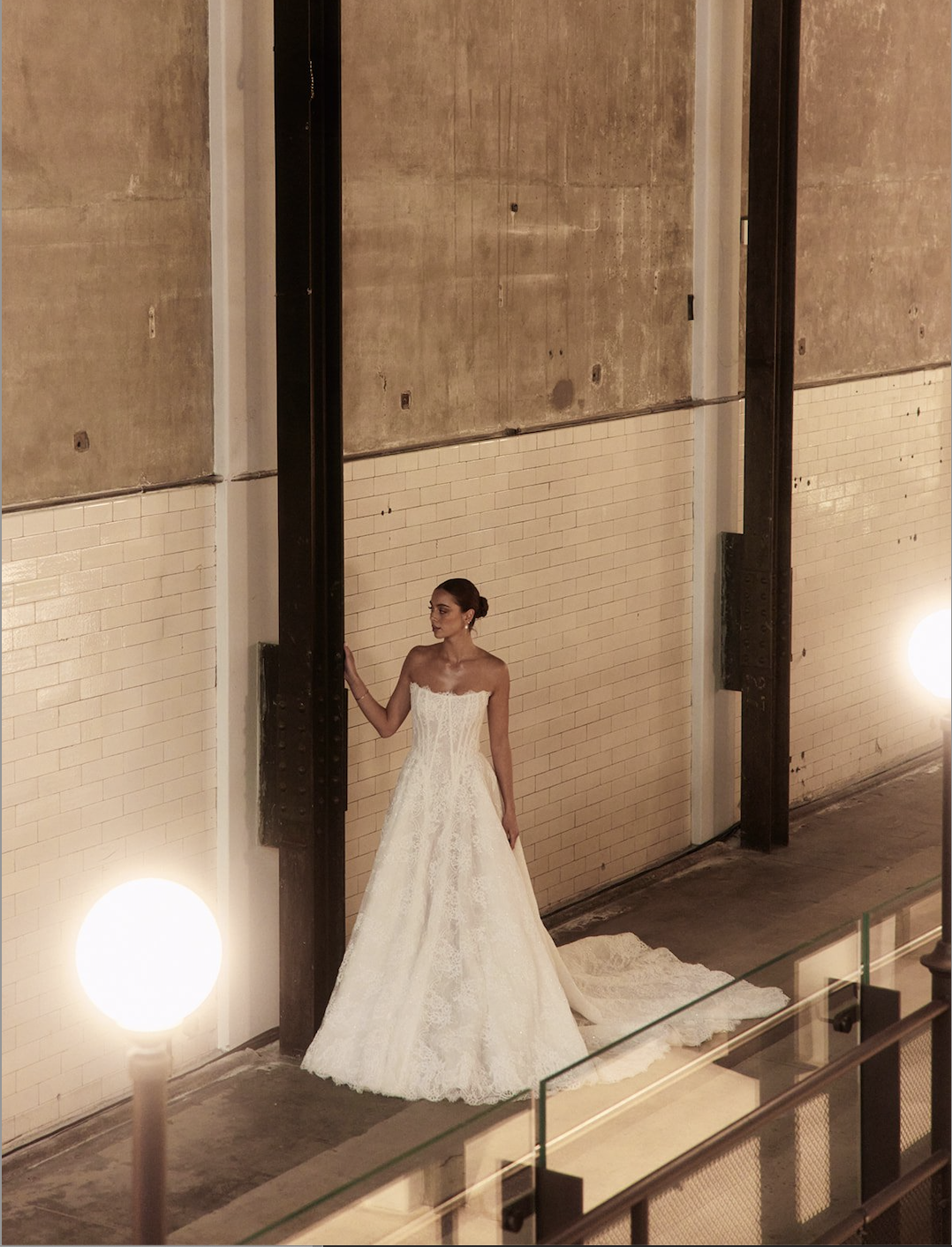 Model is wearing a lace ball gown with either a sparkling or sequin-free underlayer, highlighting intricate Chantilly lace detail.